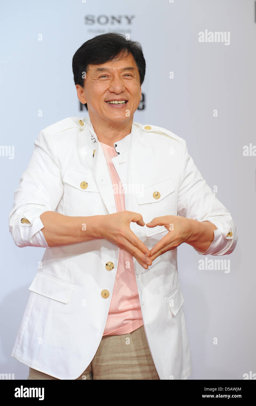Hong Kong-born actor Jackie Chan poses on the red carpet at the premiere of 'Karate Kid' in front of the Cinestar movie theatre in Berlin, Germany, 19 July 2010. The film will be shown in German cinemas starting 22 July 2010. Photo: Jens Kalaene Stock Photo