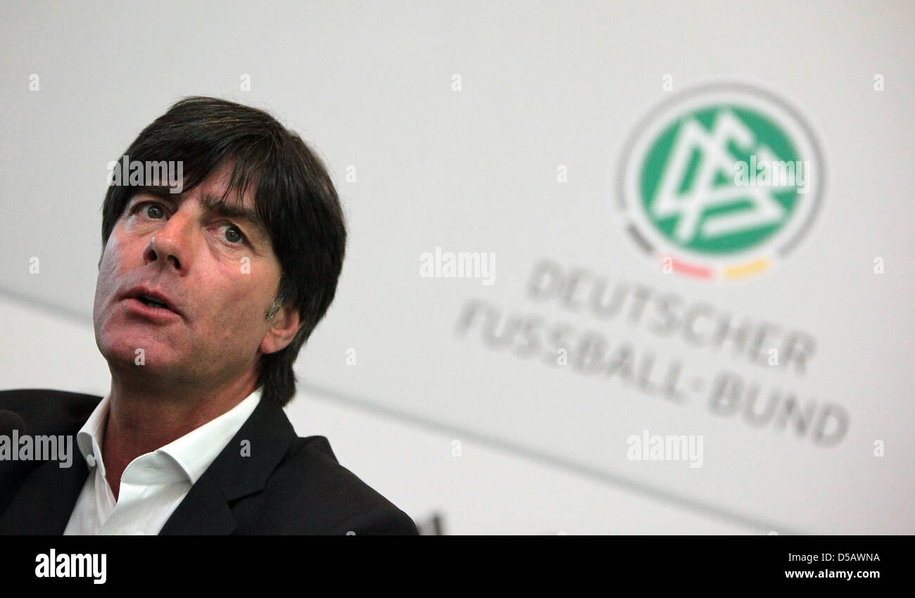Coach of the German national football team, Joachim Loew, talks at a press conference at the headquarters of the DFB in Frankfurt/Main, Germany, 20 July 2010. Oliver Bierhoff, team manager, sits next to Loew. Loew remains coach of the German team. The 50 year-old extended his contract with the DFB until the European Championship in 2012, so did team manager Oliver Bierhoff and the  Stock Photo