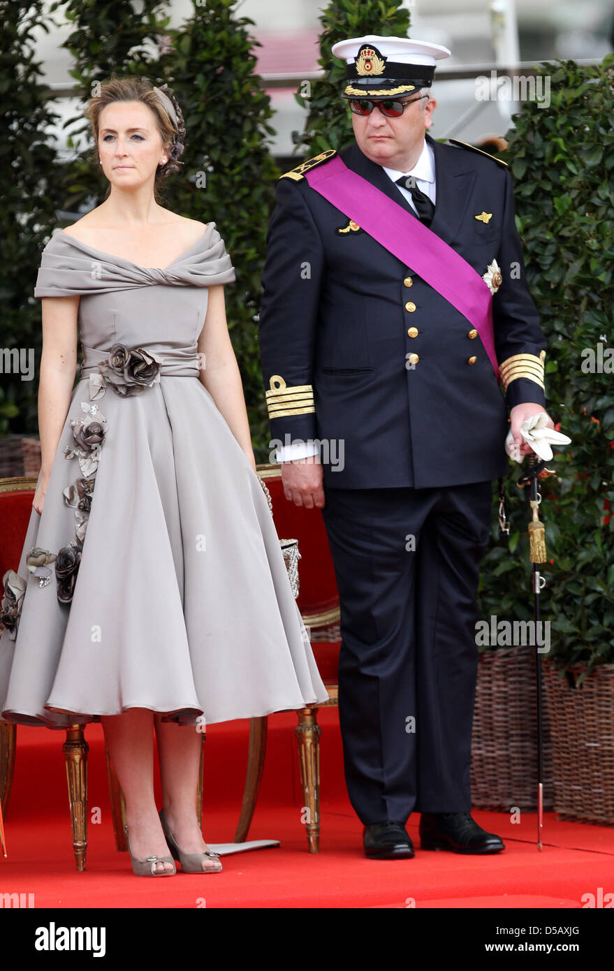 Belgian Prince Laurent (L) is pictured with Princess Claire (R) and her  daughter Princess Louise on the podium during the military parade on the  occasion of Belgium?s National Day in Brussels, Belgium