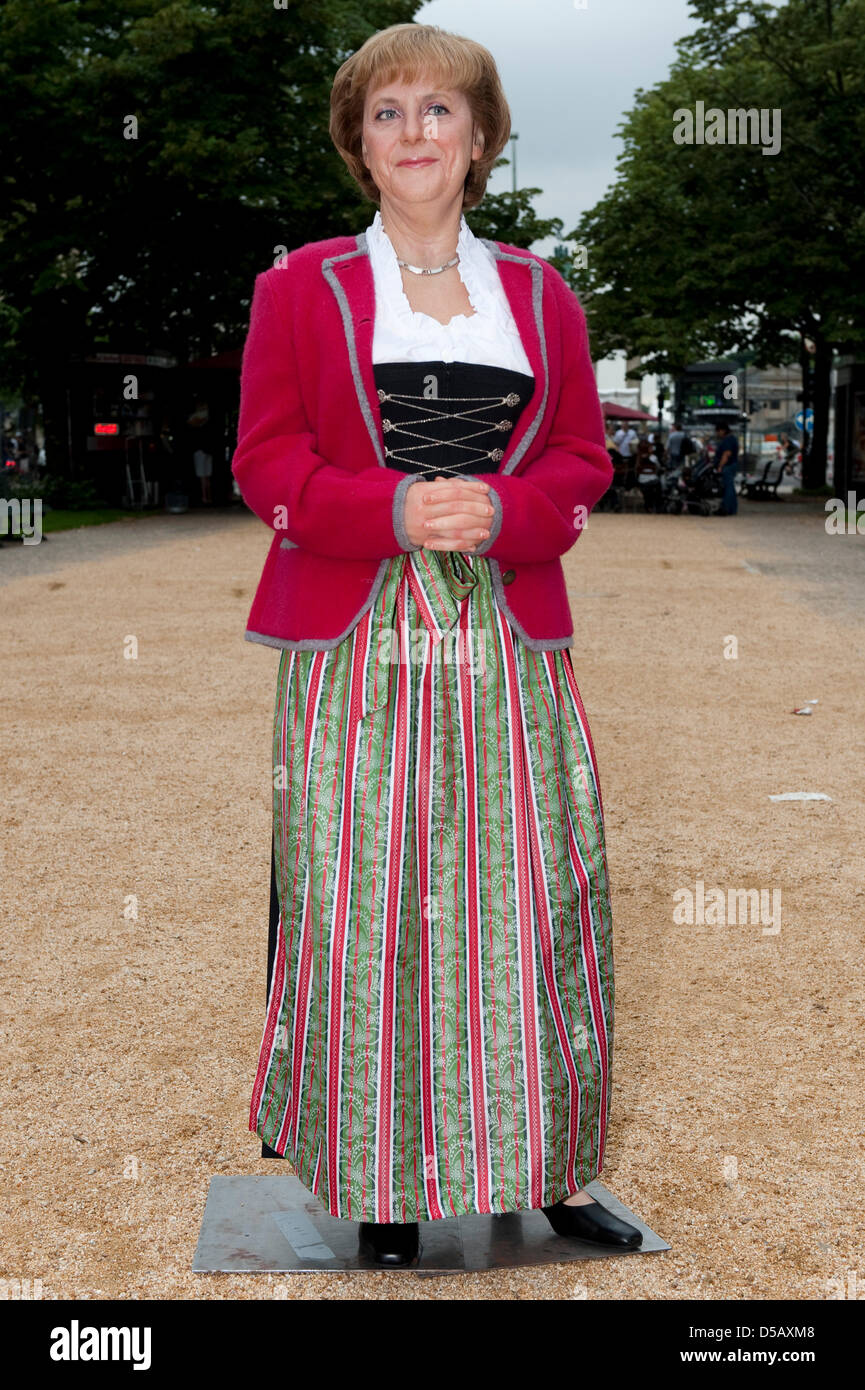German Chancellor Angela Merkel's wax figure is dressed in a dirndl  (traditional Alpine garment) at Madame Tussaud's in Berlin, Germany, 23  July 2010. On the occasion of Mekel's trips to Bayreuth and