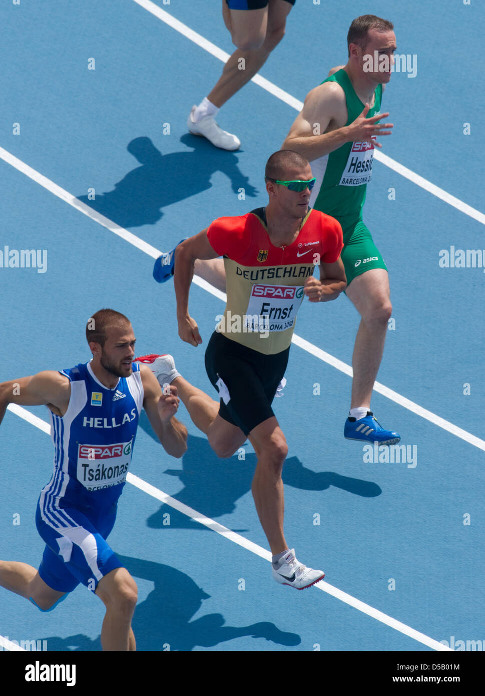 European Athletics Championships at the Lluis Companys Olympic Stadium in Barcelona, Spain, 29 July 2010. German sprinter Sebastian Ernst (M) performs during the qualification round of the 200 metres run. Below, Lykourgos Stefanos from Greece, above, Paul Hession from Ireland. Photo: Bernd Thissen Stock Photo
