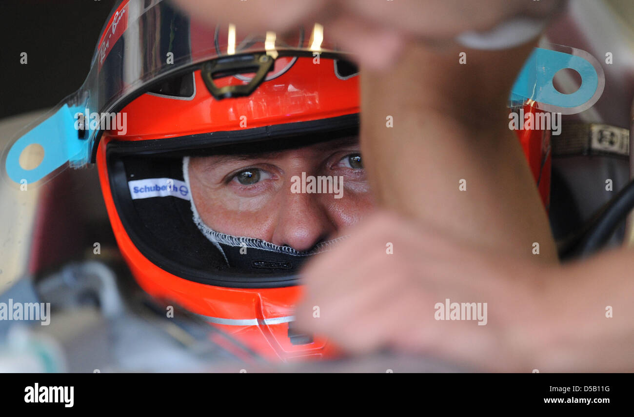 German race driver Michael Schumacher of Mercedes GP sits in his car