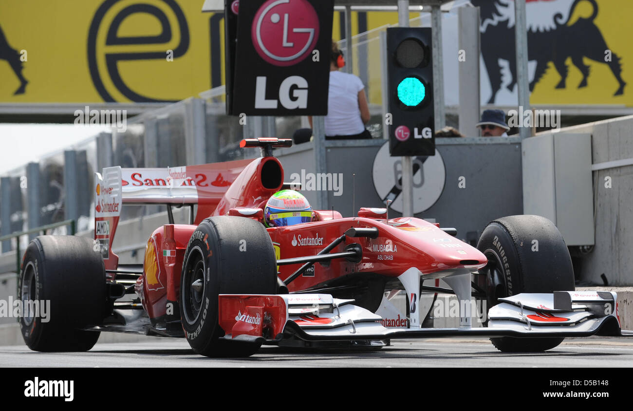 Brazilian driver Felipe Massa of Ferrari drives his car out of the pit ...