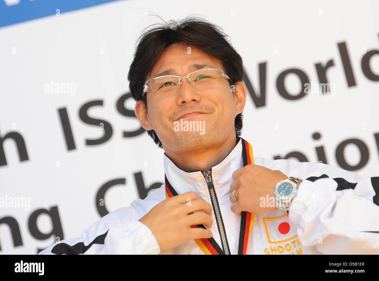 The Japanese shooting competitor Tomoyuki Matsuda celebrates his victory in the category 50 metre pistol during the ISSF Shooting World Cup in Garching nearby Munich, Germany, 1 August 2010. Photo: ANDREAS GEBERT Stock Photo