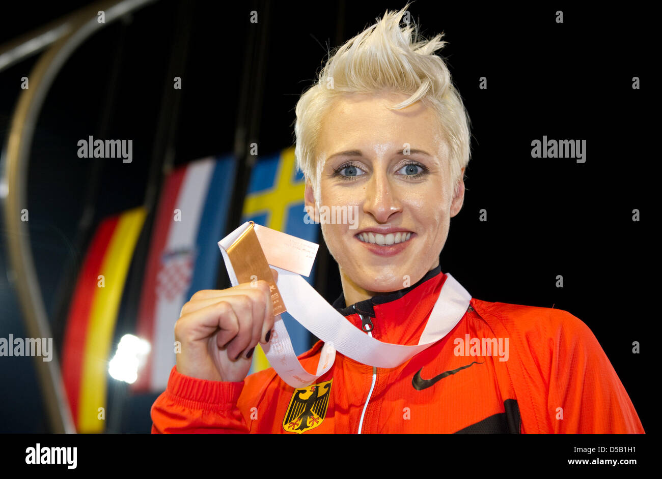 German high jumper Ariane Friedrich proudly shows her bronze medal in the women's high jump competition at the European Athletics Championships in Barcelona, Spain, 01 August 2010. Photo: Bernd Thissen Stock Photo