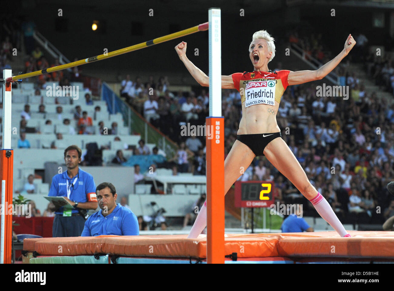 German high jumper Ariane Friedrich leaps up in joy after winning the bronze medal in the women's high jump competition at the European Athletics Championships in Barcelona, Spain, 01 August 2010. Photo: Rainer Jensen Stock Photo