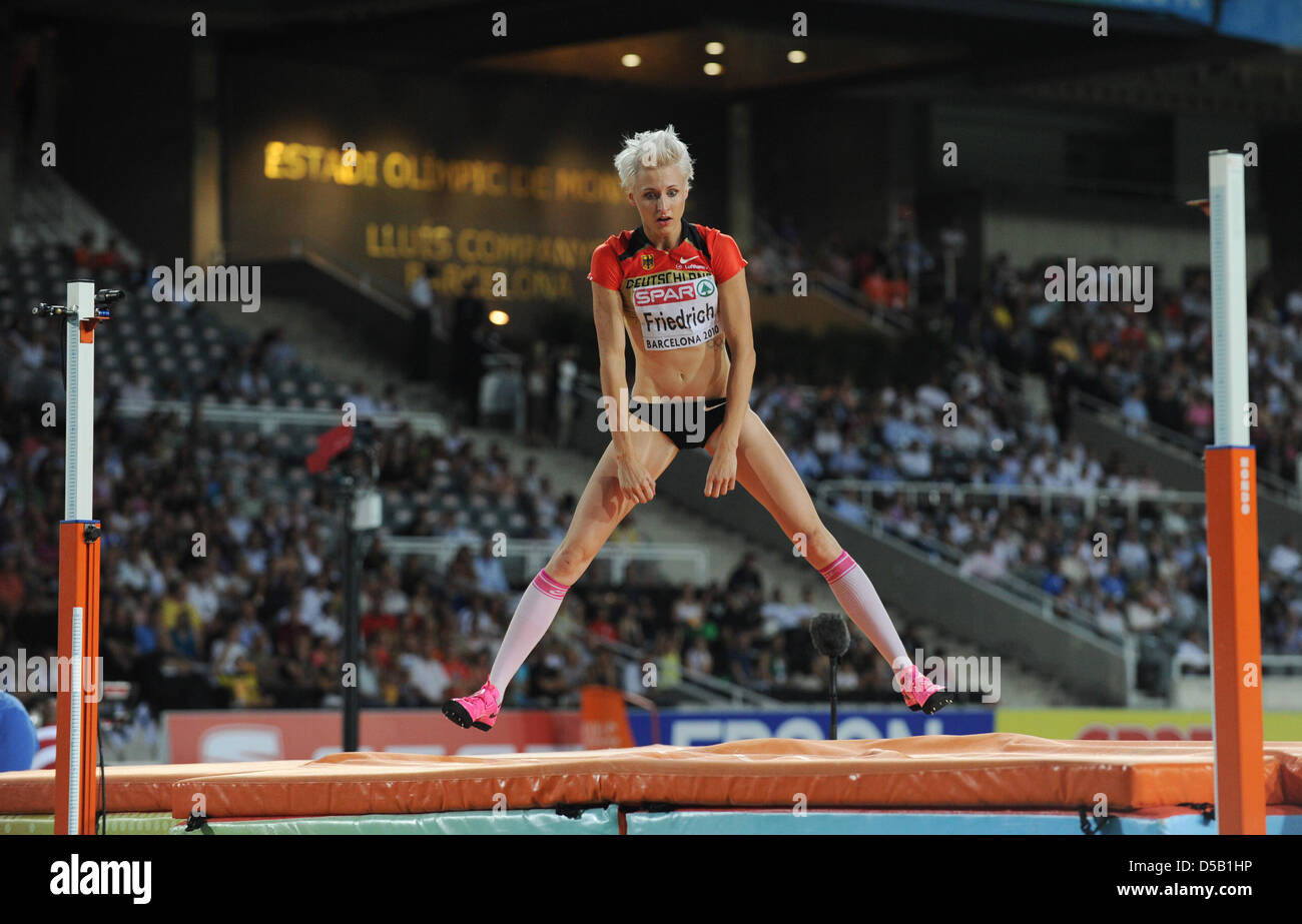German high jumper Ariane Friedrich leaps up in joy after winning the ...