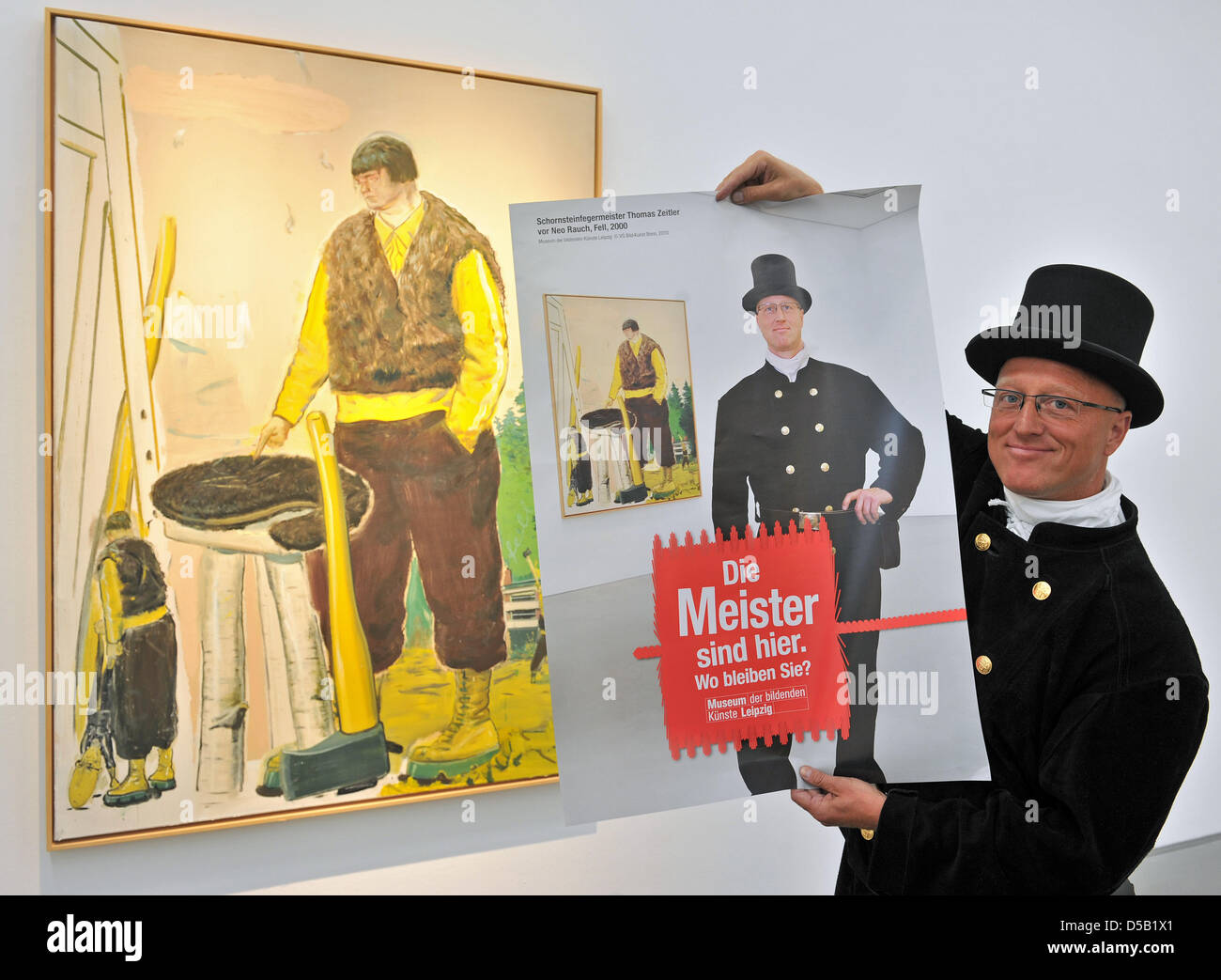 Chimney sweep master craftsman Thomas Zeitler from Leipzig presents a poster depicting himself in front of the Neo Rauch painting 'Fur' at the Museum of Fine Arts in Leipzig, Germany, 2 August 2010. The poster is part of the campaign 'The masters are here. Where are you?', which wants to attract more visitors from the local area. Twelve master craftsmen have been photographed in fr Stock Photo