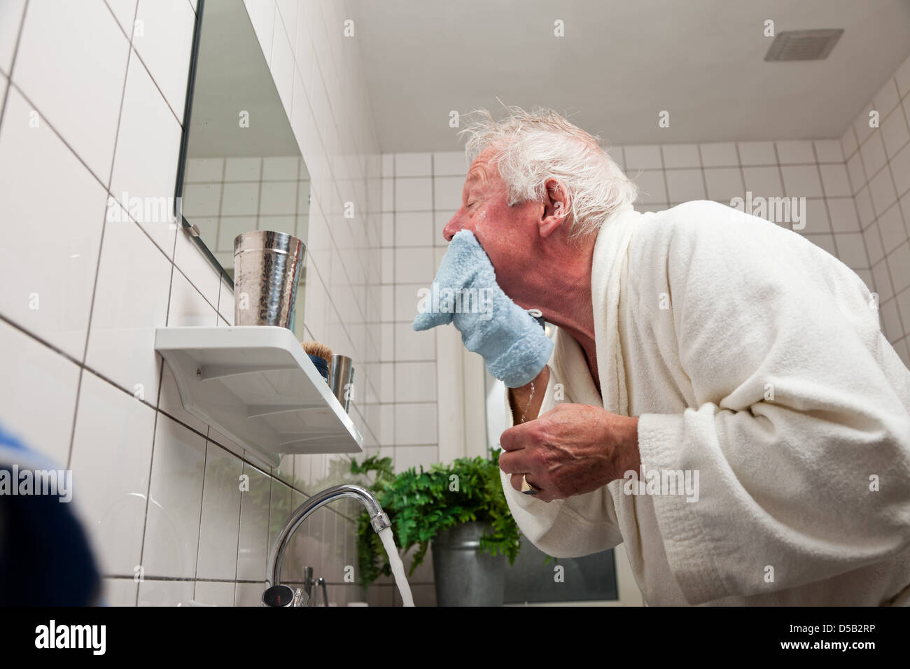 Senior man wash face hires stock photography and images Alamy