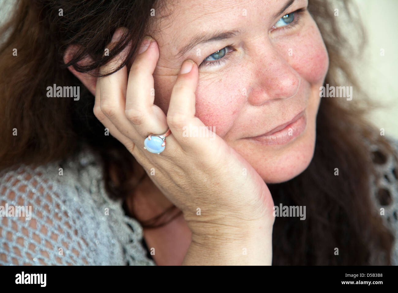 Dreamy Woman wearing Moonstone Ring Stock Photo