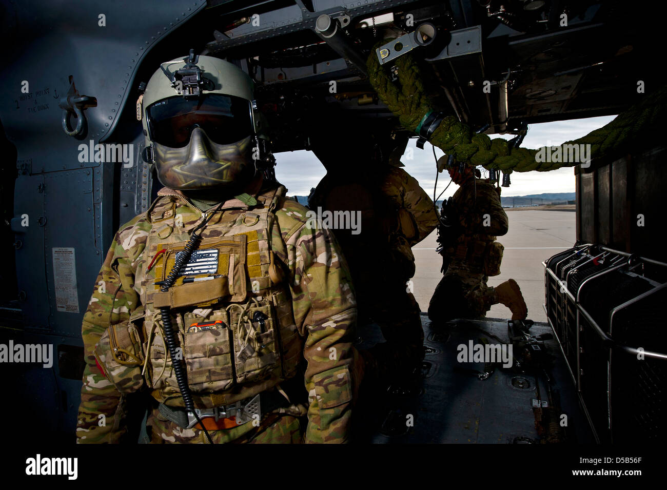 An aerial gunner with the US Air Force 66th Rescue Squadron stands all ready before a training exercise March 18, 2013 at the Orchard Combat Training Center, Idaho. Stock Photo