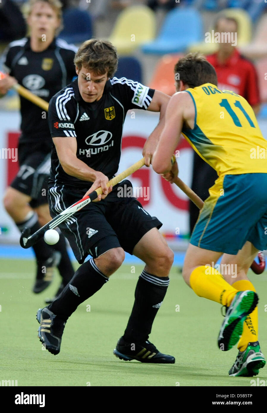 German hockey player Oliver Korn (L) in action against Australia's Luke Doerner (R)in the men's