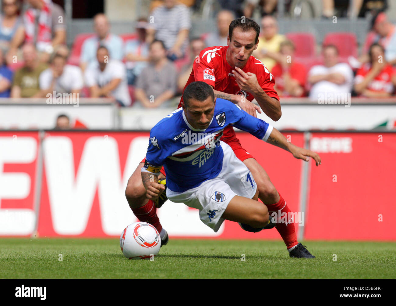 Cologne's Petit (R) tackles Sampdoria's Angelo Palombo (L) during their test match in Cologne, Germany, 07 August 2010. Photo: ROLF VENNENBERND Stock Photo