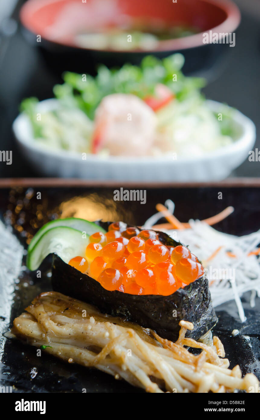 Salmon roe sushi with cucumber and fried golden needle mushroom Stock