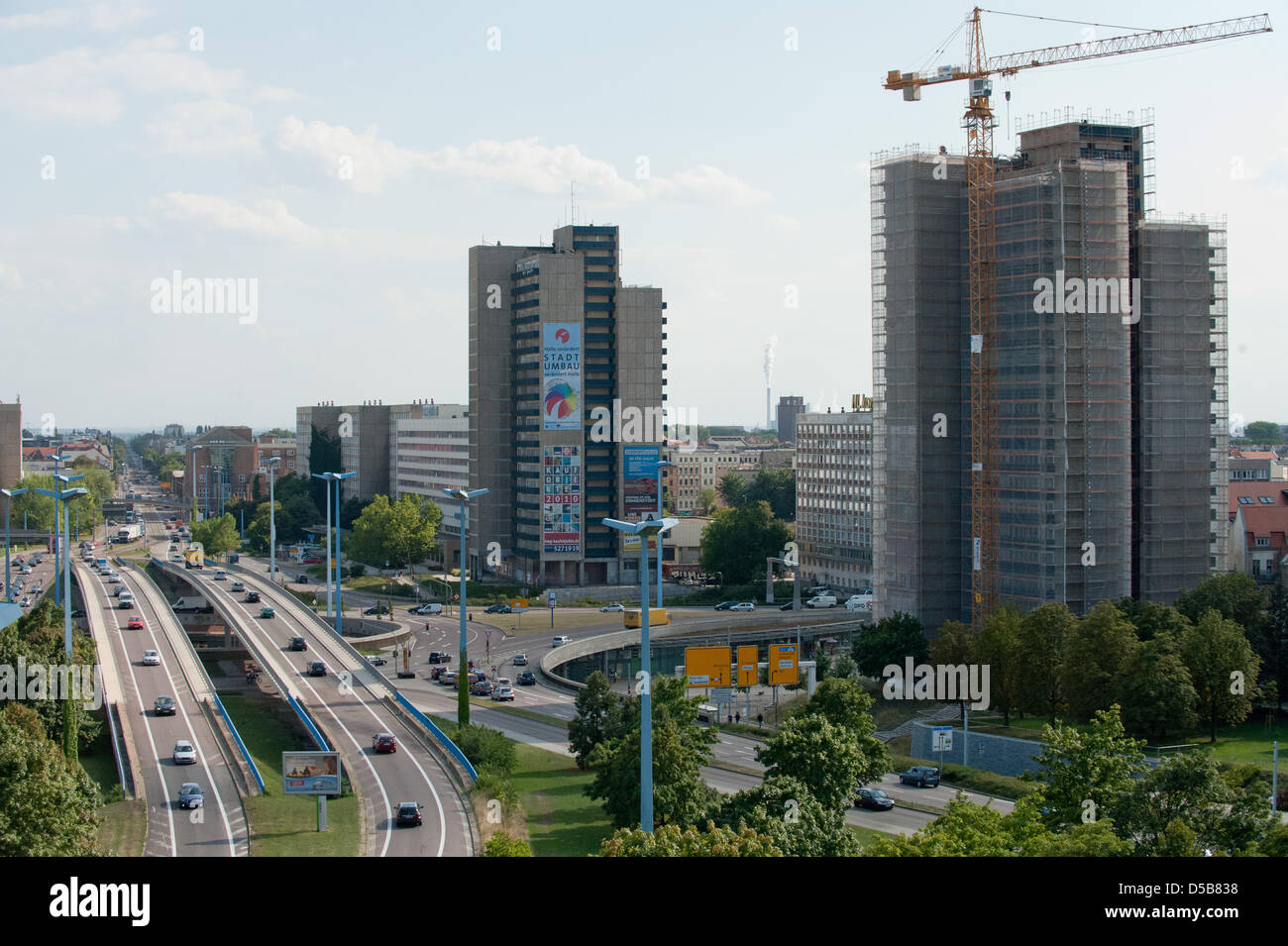 The demolition of the first high-rise (R) in the centre of Halle (Saale) has begun, Germany, 10 August 2010. The future of the two empty GDR-plattenbau-buildings was in discussion for a long time. The 1,1 million Euro demolition is halfly funded by subsidies from 'Stadtumbau-Ost'(city-rebuild-East) and is supposed to last until January 2011. This areal is also the focus of the Inte Stock Photo