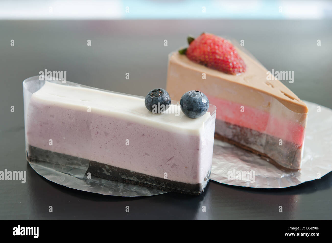 close up blueberries cheesecake and strawberry cheesecake Stock Photo