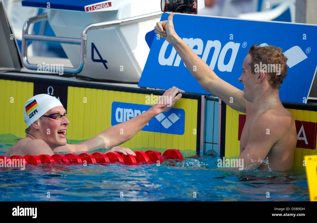 German swimmer Christian Kubusch congratulates French swimmmer ...