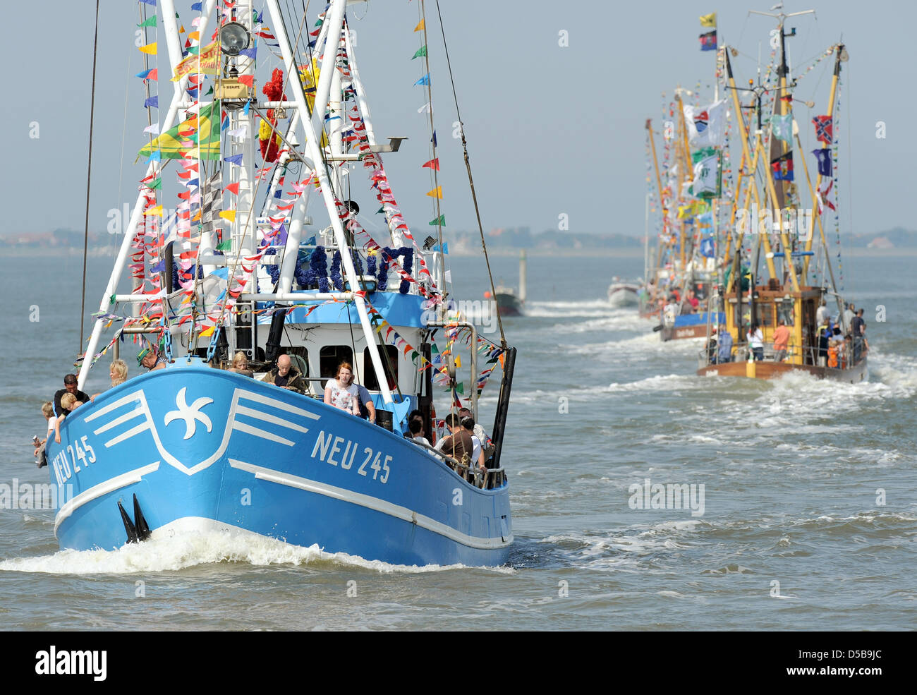 Two shrimp cutters arrive for the 44th Cutter Regatta in Neuharlingsiel, Germany, 14 August 2010. Winner of the Cutter Regatta will be the ship that impresses the spectators the most. Photo: INGO WAGNER Stock Photo