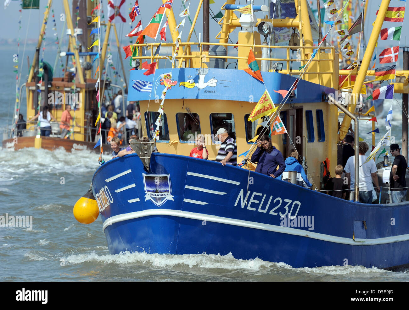 Two shrimp cutters arrive for the 44th Cutter Regatta in Neuharlingsiel, Germany, 14 August 2010. Winner of the Cutter Regatta will be the ship that impresses the spectators the most. Photo: INGO WAGNER Stock Photo