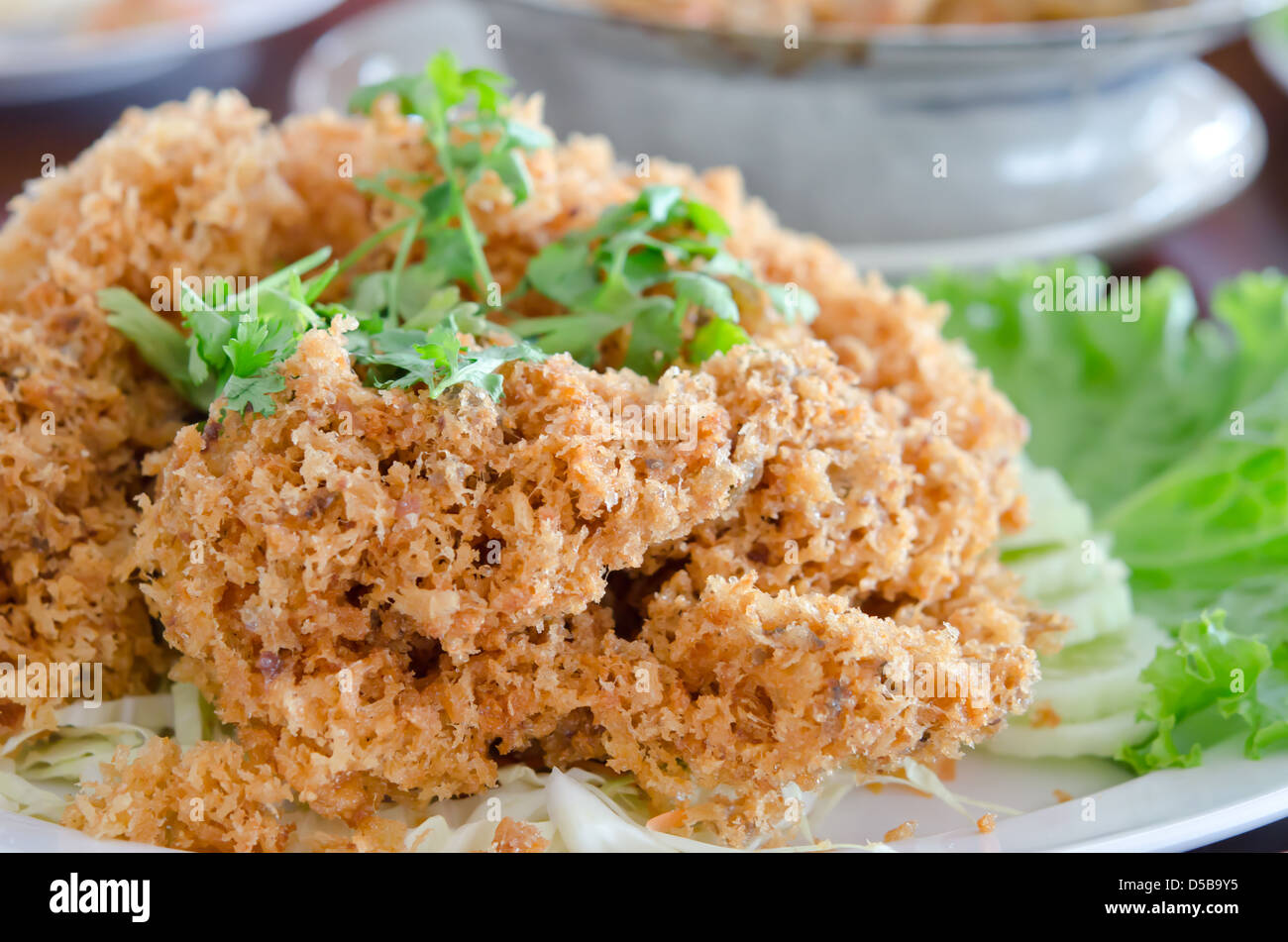 crispy catfish served with fresh vegetable . Thai food Stock Photo