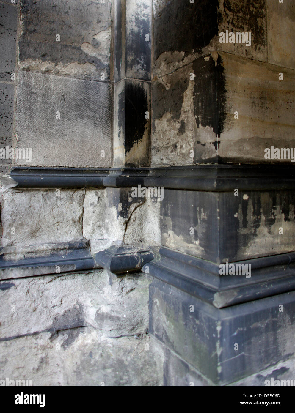 Stones at the northeast pillar of the north tower of the Cologne Cathedral are pictured on 24 August 2010, Germany. The trachyte stones that date back to the middle ages are partially severely damaged, also due to reactions to Sandstone from Oberkirchen that was integrated into the building in the 19th century. A science project shall give answers to the connection between the two  Stock Photo