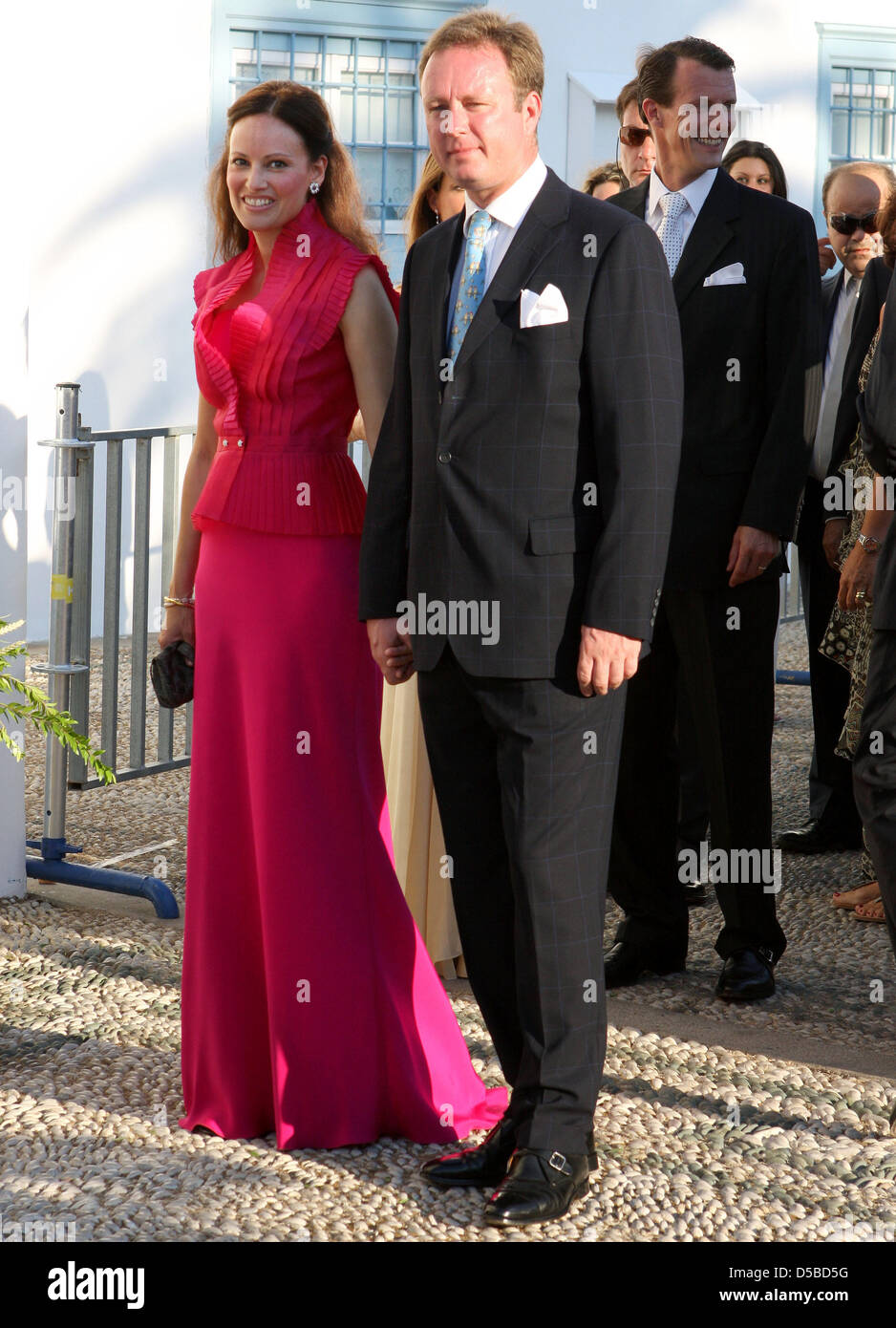 Prince Gustav of Sayn-Wittgenstein-Berleburg and his fiancee Carina Axelsson arrive at the Agios Nikolaos church for the wedding ceremony of Nikolaos, son of the former Greek king, and his bride Tatiana Blatnik on Spetses Island, Greece, 25 August 2010. The couple got married in the whitewashed 19th-century cathedral. The wedding was attended by royals from all over Europe, includi Stock Photo
