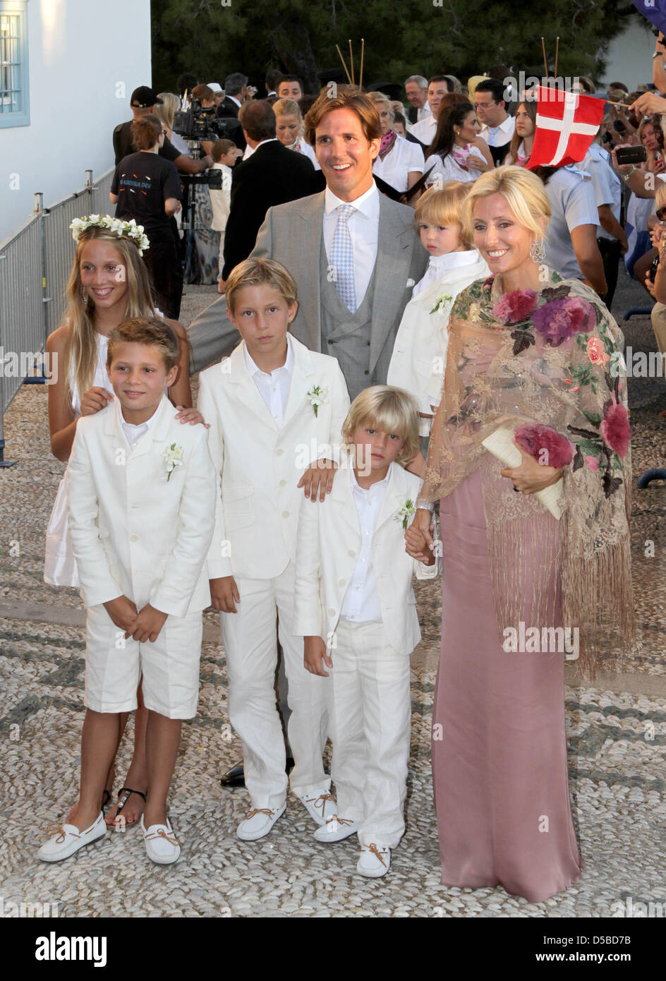 Crown Prince Pavlos of Greece and Crown Princess Marie-Chantal arrive with children, Princess Maria-Olympia (L), Prince Constantine Alexios (3rd L), Prince Achileas-Andreas (2-L), Prince Odysseas-Kimon (C) and Prince Aristide Stavros (2-R) at the Agios Nikolaos church for the wedding ceremony of Nikolaos, son of the former Greek king, and his bride Tatiana Blatnik on Spetses Island Stock Photo