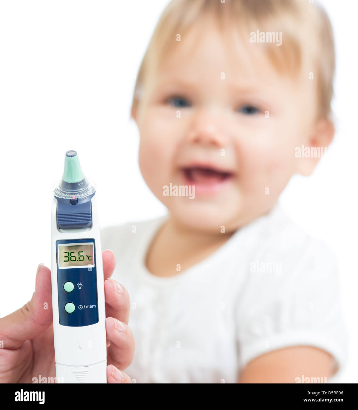 Thermometer displaying 36,6 Celsius degrees on defocused happy kid