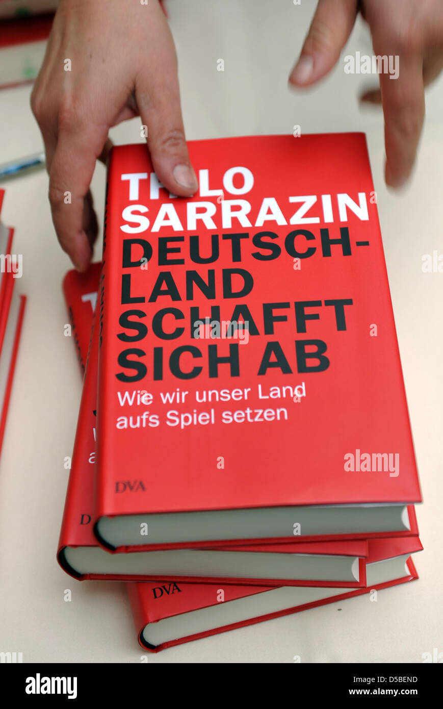 Copies of Thilo Sarrazin's book 'Germany abolishes itself: How we compromise our country' are on display at a press conference in Berlin, Germany, August 2010. The controversial book outlines the author's view that Germans are in danger of becoming 'strangers in their own country' due to muslim immigration. Photo: RAINER JENSEN Stock Photo