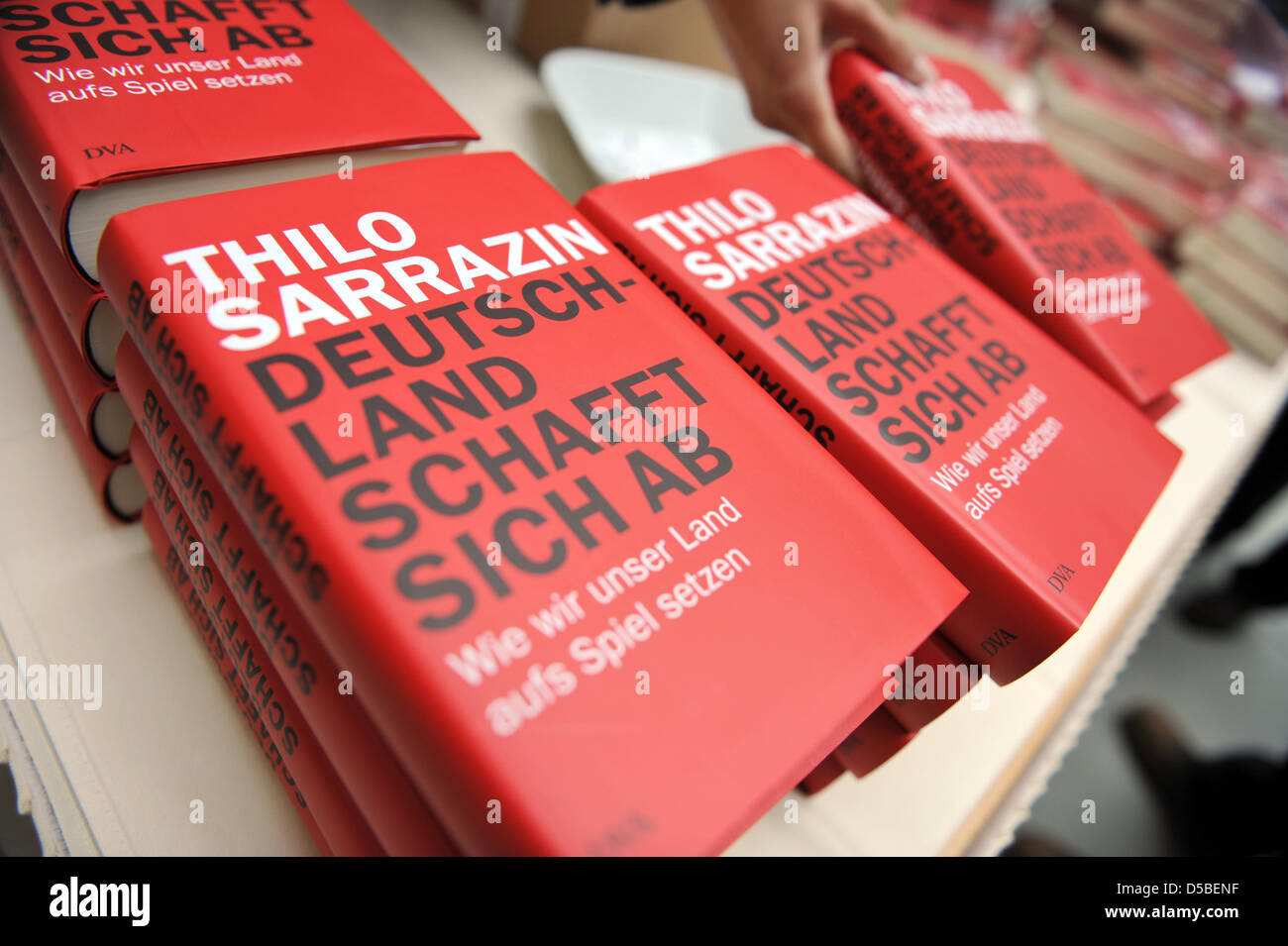 Copies of Thilo Sarrazin's book 'Germany abolishes itself: How we compromise our country' are on display at a press conference in Berlin, Germany, 30 August 2010. The controversial book outlines the author's view that Germans are in danger of becoming 'strangers in their own country' due to muslim immigration. Photo: RAINER JENSEN Stock Photo