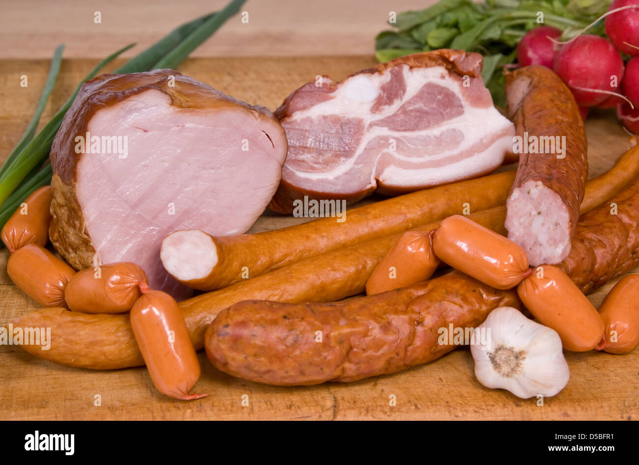 different species of hams and sausage on board Stock Photo