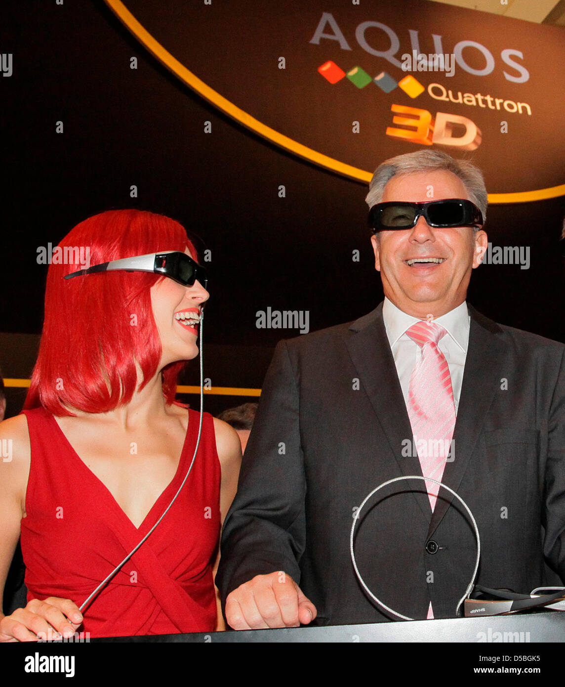 THe mayor of Berlin, Klaus Wowereit and Miss IFA wear glasses at the exhibition hall of the IFA International radio exhibition Berlin, Germany, 03 September 2010. The worldwide biggest industrial exhibition for consumer electronics will be open from 03 until 08 September 2010 at the exhibition hall situated under the radio tower in Berlin. Photo: Wolfgang Kumm Stock Photo