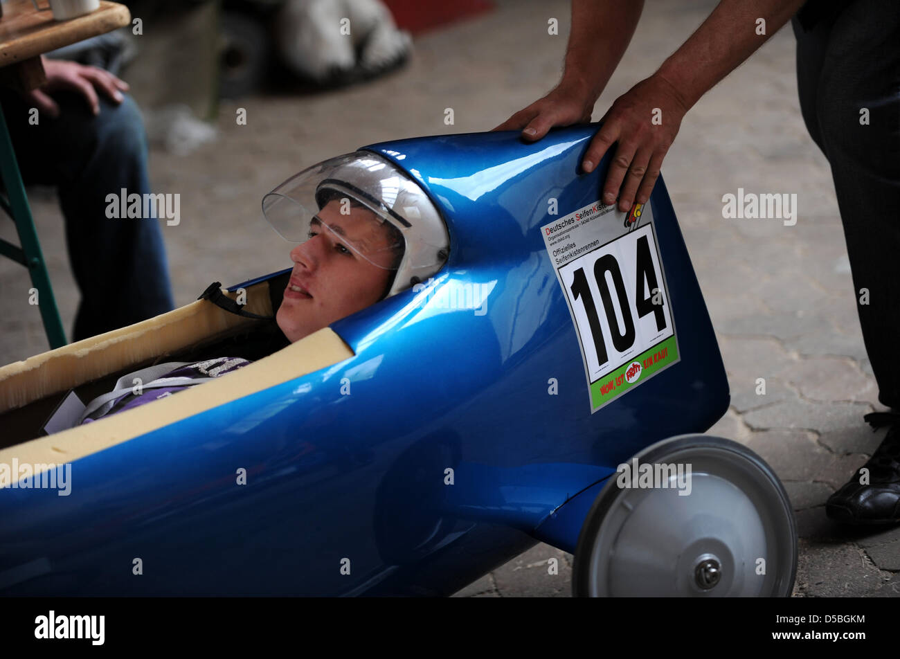 Martin sits in his soapbox racer during the weighing in Holzhausen, Germany, 3 September 2010. The German Soap Box Derby Racer Championship started on 3 September 2010. The main street in Holzhausen will be closed for the race. Photo: Uwe Zucchi Stock Photo