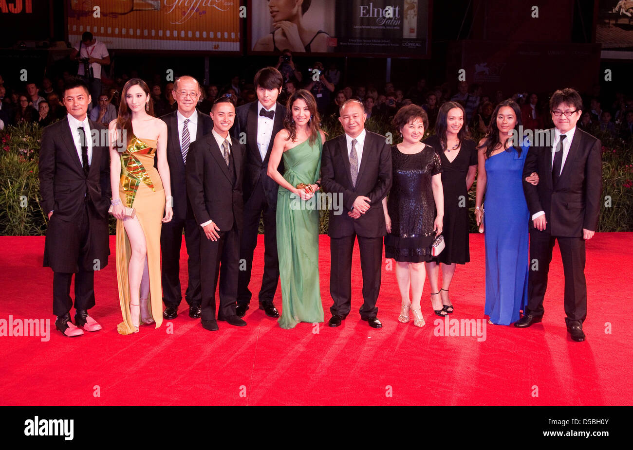Actor Shawn Yue (L), actress Pace Wu (2nd L) producer Terence Chang (3rd L), actor Jung Woo Sung (5nd L), actress Michelle Yeoh (C left), director John Woo (C right), Annie Woo (4nd R), actress Angeles Woo (2nd R) and director Su Chao Pin (R) attend the premiere of 'Reign Of Assassins' during the 67th Venice International Film Festival in Venice, Italy, 03 September 2010. The film  Stock Photo