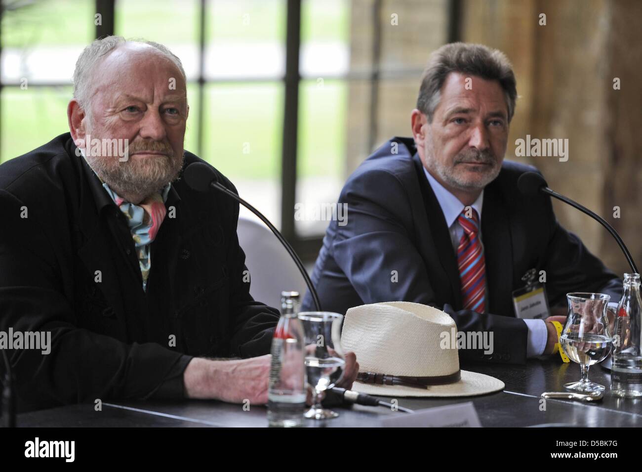 Danish cartoonist Kurt Westergaard (L) and the Mayor of Potsdam Jann Jakobs speak during a news conference before the award of the M100 Media Prize 2010 in Potsdam, Germany, 8 September 2010. Westergaard initiated a controversial with 12 caricatures of the Prophet Mohammed, that were first published in a Danish newspaper in 2005. The draw Stock Photo