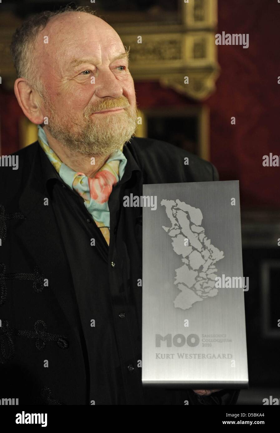 Danish cartoonist Kurt Westergaard poses with his award after receiving the M100 Media Prize 2010 in Potsdam, eastern Germany, September 8, 2010. Westergaard drew the most controversial of 12 caricatures of the Prophet Mohammed, first published in a Danish newspaper in 2005, which many Muslims considered offensive. The drawings sparked protests in January and February 2006 that cul Stock Photo
