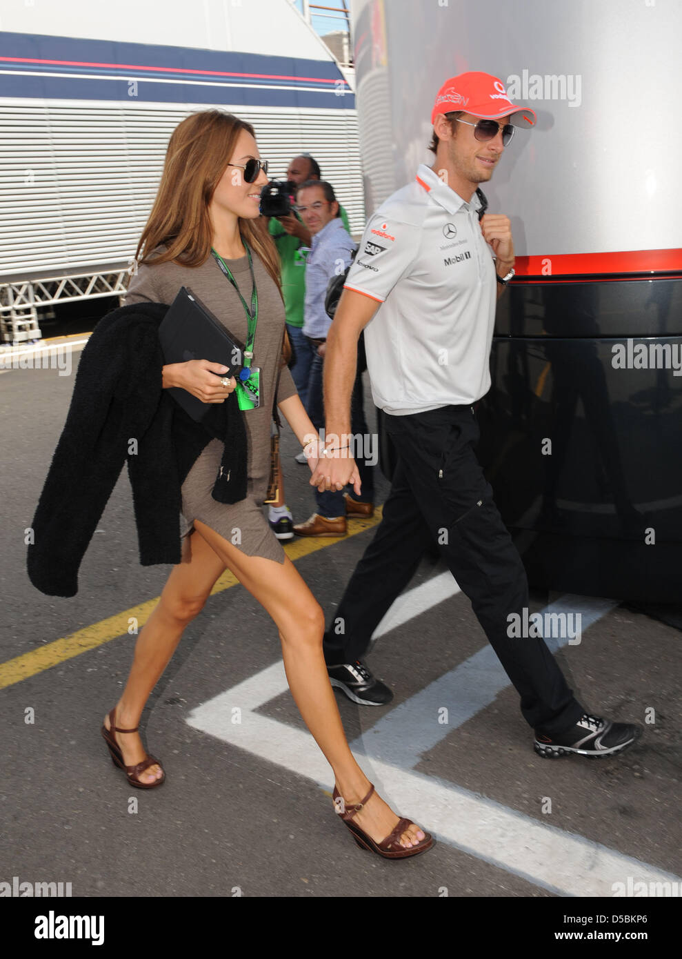 Briton Jenson Button of Mc Laren Mercedes and his girlfriend Jessica Michibata walk through the paddock at the International circuit 'Autodromo Nazionale' in Monza, Italy, 09 September 2010. Monza hosts the Formula One Italian Grand Prix on 12 September 2010. Photo: Peter Steffen Stock Photo