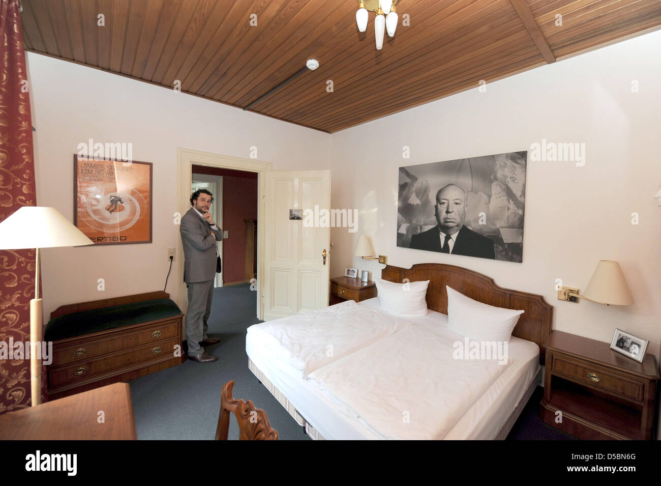 Hotel manager Christoph Boehnk stands in the Hitchcock room at the newly established murder mytery hotel in Hillesheim, Germany, 8 September 2010. The murder mystery hotel is the first of its kind to open its doors in Germany featuring individually designed rooms in the fashion of various mystery story themes from the tales of Sherlock Holmes, Miss Marple, Hercule Poirot, James Bon Stock Photo