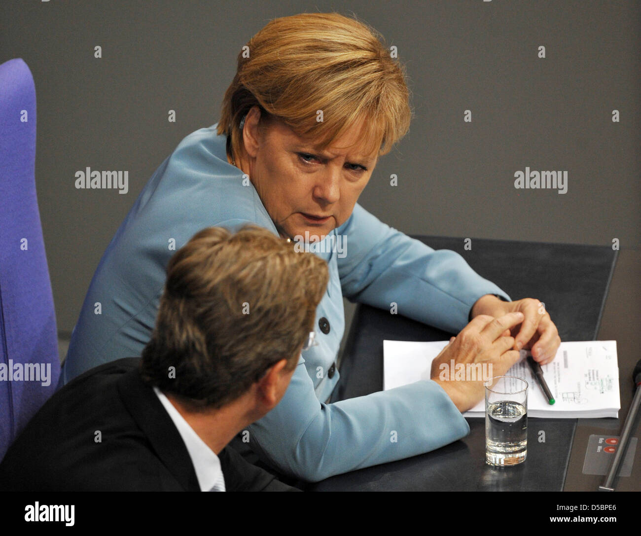 German Chancellor Angela Merkel and German Foreign Minister and Vice Chancellor Guido Westerwelle attend a Bundestag (German Parliament) session at the Reichstag in Berlin, Germany, 14 September 2010. The German Parliament is discussing the controversial 2011 budget, which entails spending cuts adding up to 12 billion euros, mainly in social services. Photo: RAINER JENSEN Stock Photo