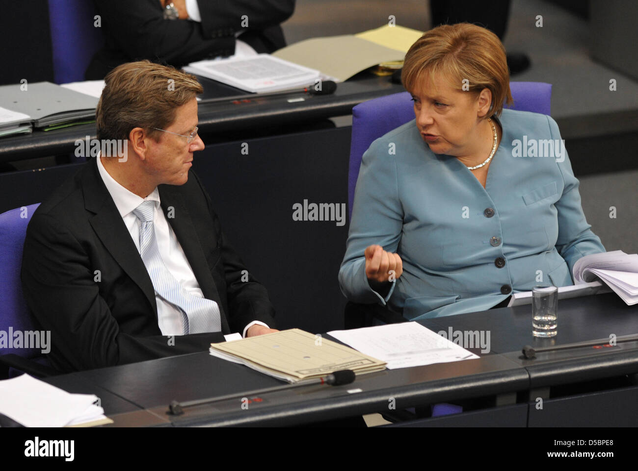 German Chancellor Angela Merkel and German Foreign Minister and Vice Chancellor Guido Westerwelle attend a Bundestag (German Parliament) session at the Reichstag in Berlin, Germany, 14 September 2010. The German Parliament is discussing the controversial 2011 budget, which entails spending cuts adding up to 12 billion euros, mainly in social services. Photo: RAINER JENSEN Stock Photo