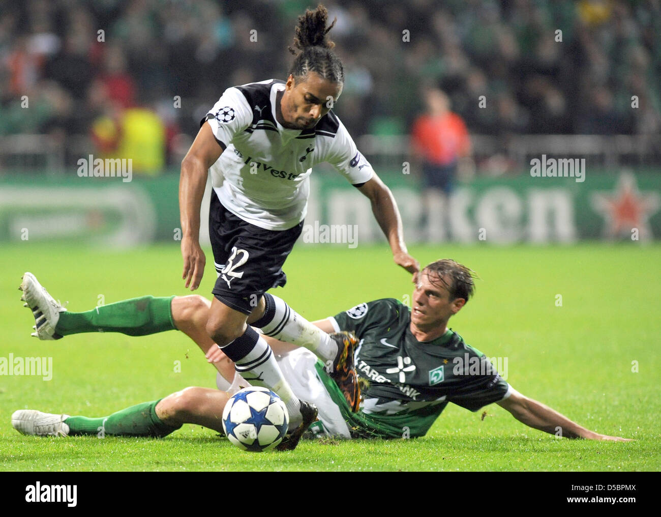 Werder Bremen faces Tottenham Hotspur in the Champions League Group A at the Weser Stadiun in Bremen, Germany, 14 September 2010. Bremen's Tim Borowski (R) vies for the ball with Tottenham's Benoit Assou-Ekotto. Photo: Ingo Wagner Stock Photo