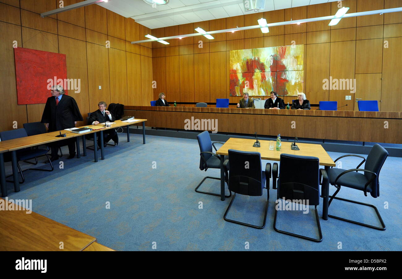 The witnesses' table is prepared for Princess Caroline of Monaco (not depicted) in front of chief judge Andreas Schlueteris (2-R) at the Regional Court as a witness in Hildesheim, Germany, 13 January 2010. Princess Caroline will bear witness that her husband Ernst August Prince of Hanover slapped the owner of a discotheque in Kenya in the face twice in an alleged attack 10 years ag Stock Photo