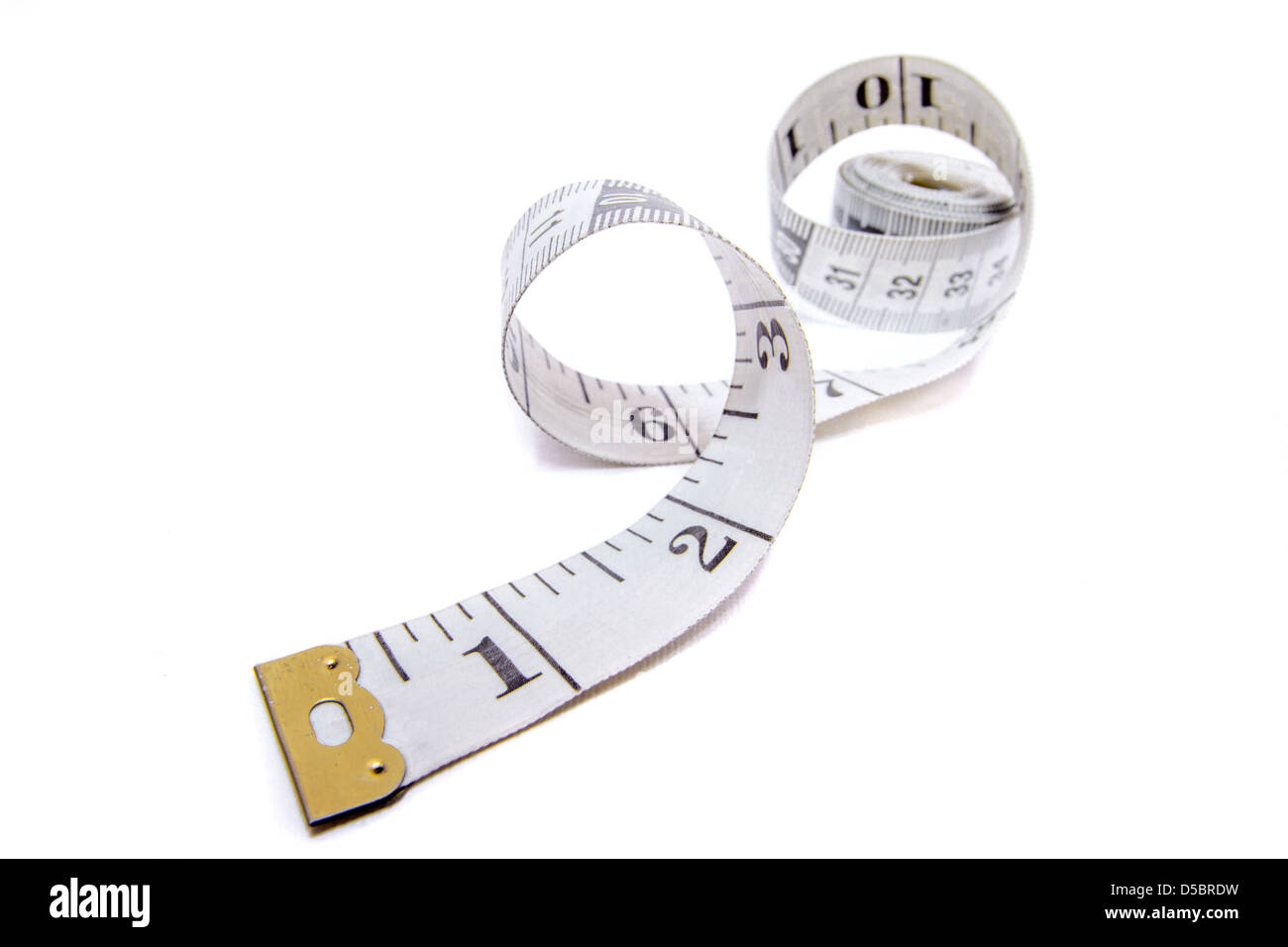 A Small Fabric Tape Measure on a White Background Stock Photo