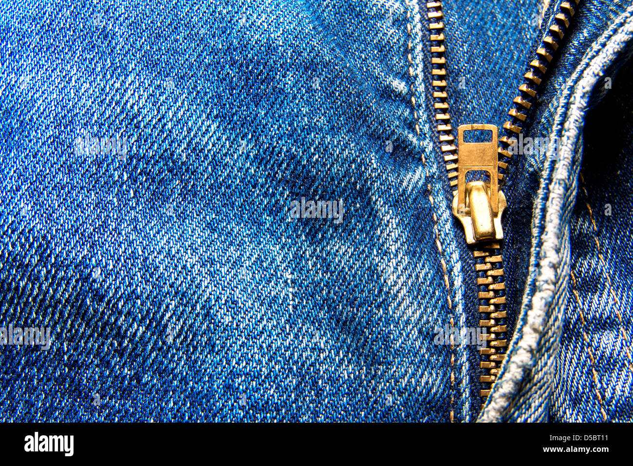 Detail of zipper on blue jeans close up Stock Photo
