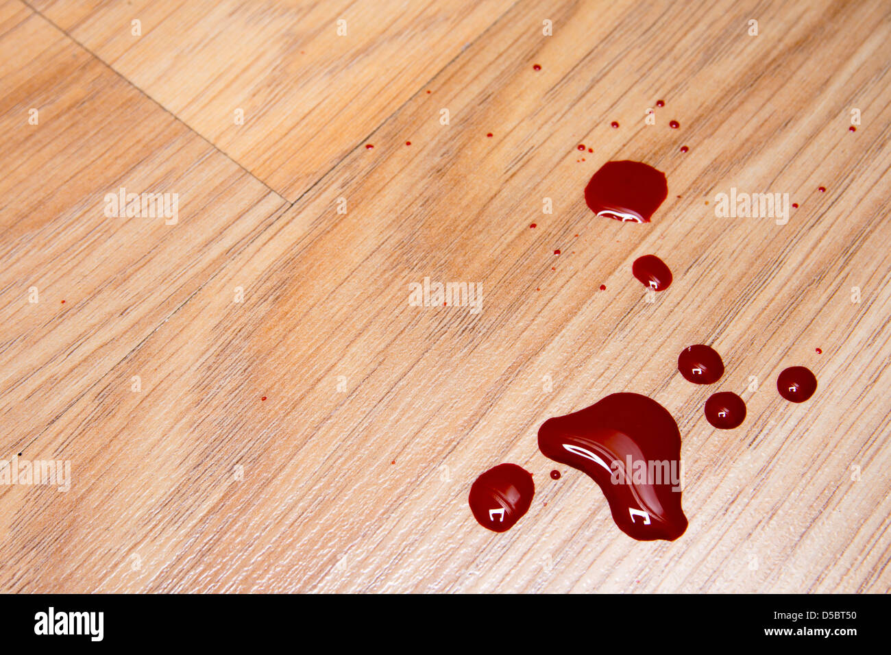 Drops of blood on laminate floor texture Stock Photo