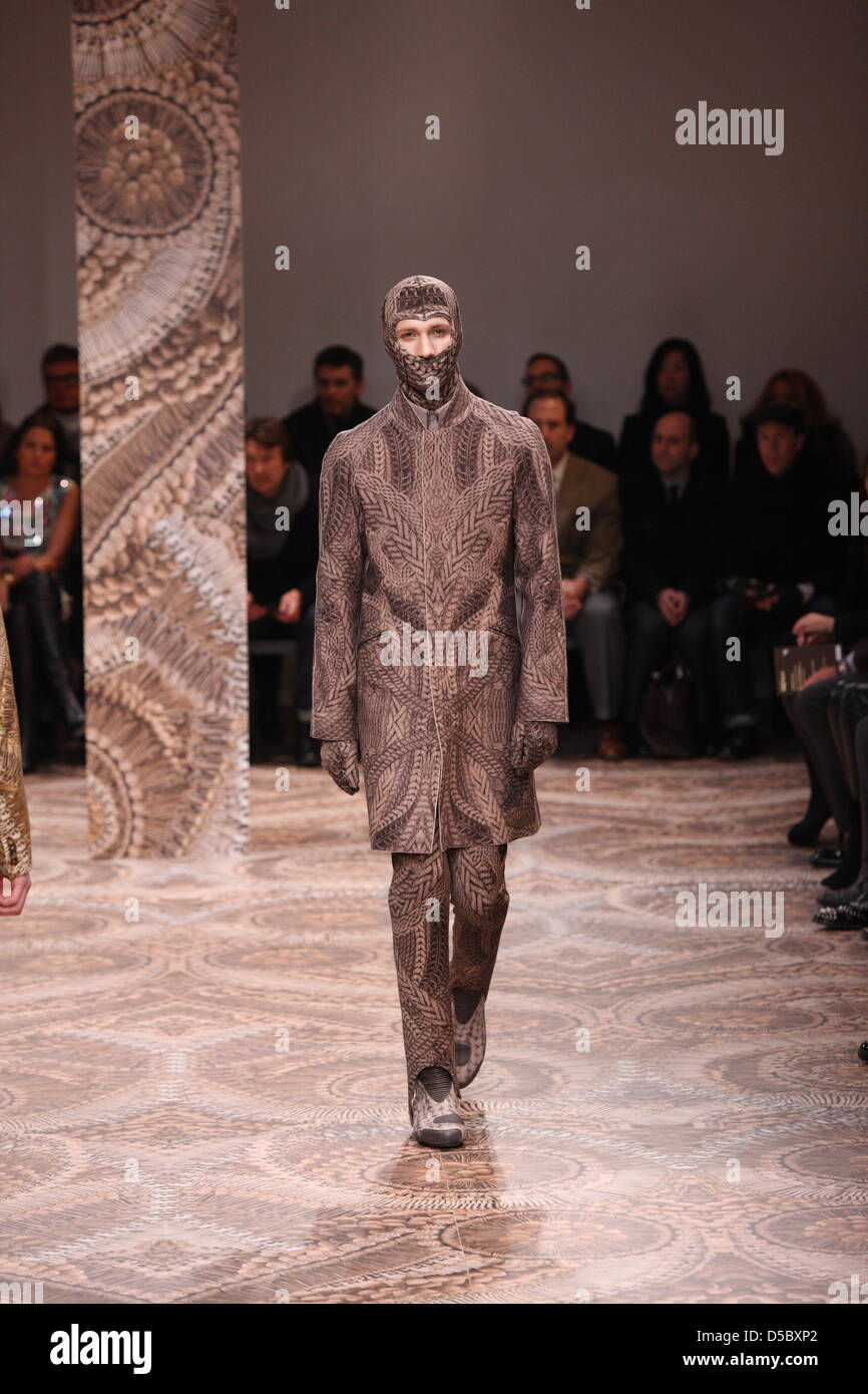 A model walks on the catwalk wearing a creation by Alexander McQueen during the Milano Moda Uomo Fall Winter 2010 11 in Milan Italy 18 January 2010. The menswear fashion event runs from 16