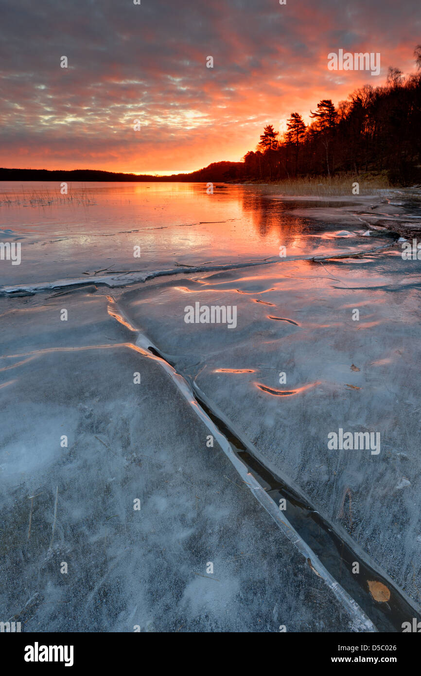 Sunrise over frozen lake Rådasjön, Mölndal, Sweden, Europe Stock Photo