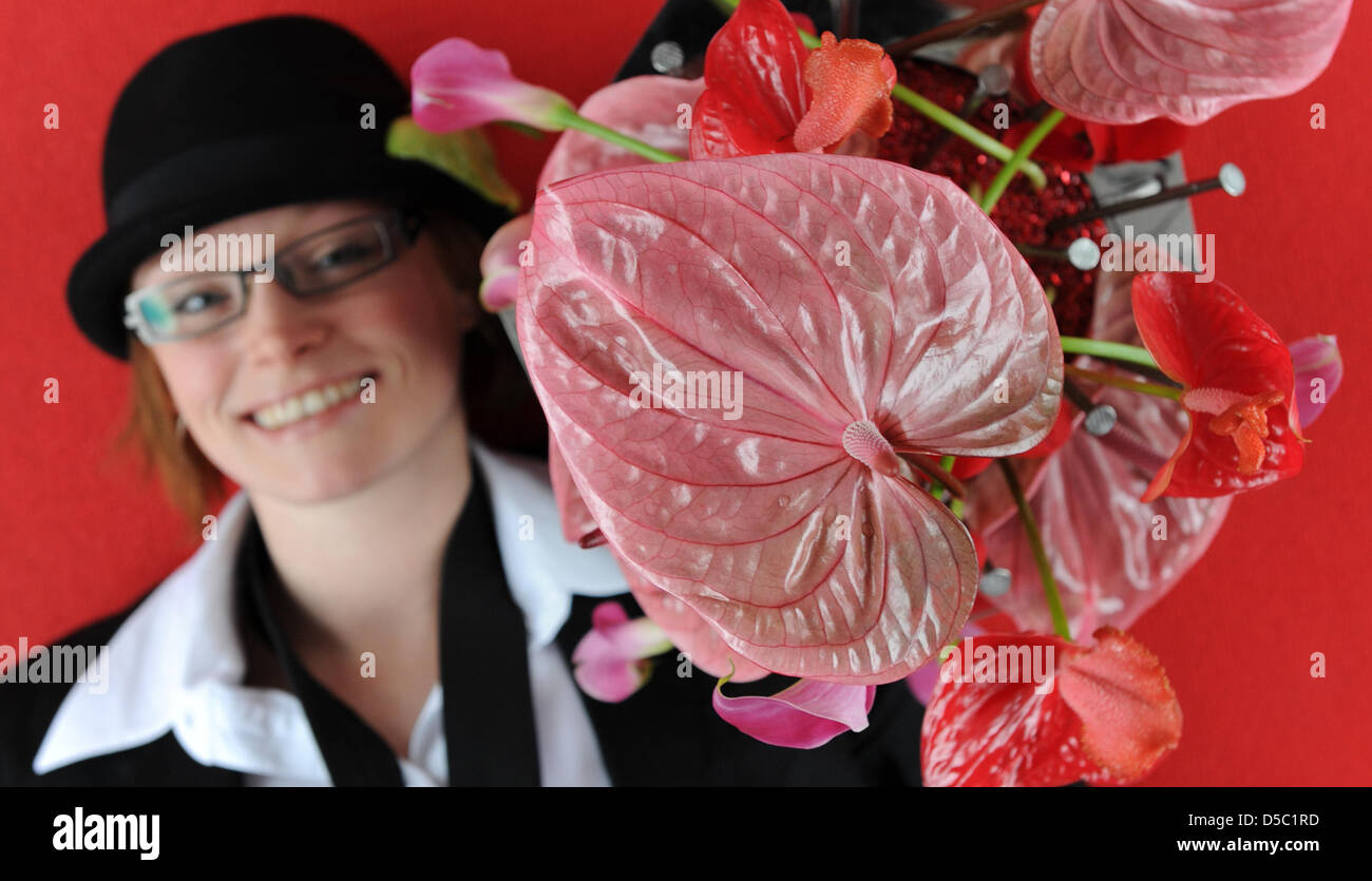 Floristics master Kathrin Goellner poses with a bouqet during a photo call promoting the international botanical and gardening fair IPM in Essen, Germany, 25 January 2010. IPM is a fair for professional visitors only and opens from 26 January to 29 January 2010. Some 1.500 exhibitors from 43 nations present their latest products in floristics, gardening and botanics. According to t Stock Photo