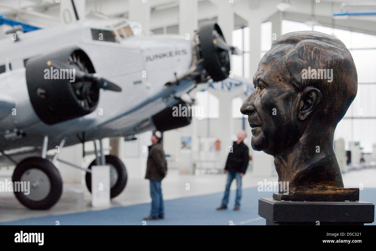 FILE - The file photo dated 18 January 2010 shows a three-engined Junkers JU-52, designed by German engineer Hugo Junkers (1859-1935) next to a bust of Hugo Junkers (R) on display at the 'Technikmuseum Hugo Junkers' in Dessau, Germany. Hugo Junkers, one of the most important air craft designers of his time, died 75 years ago. Among other planes, he designed the landmark F13 (in1919 Stock Photo