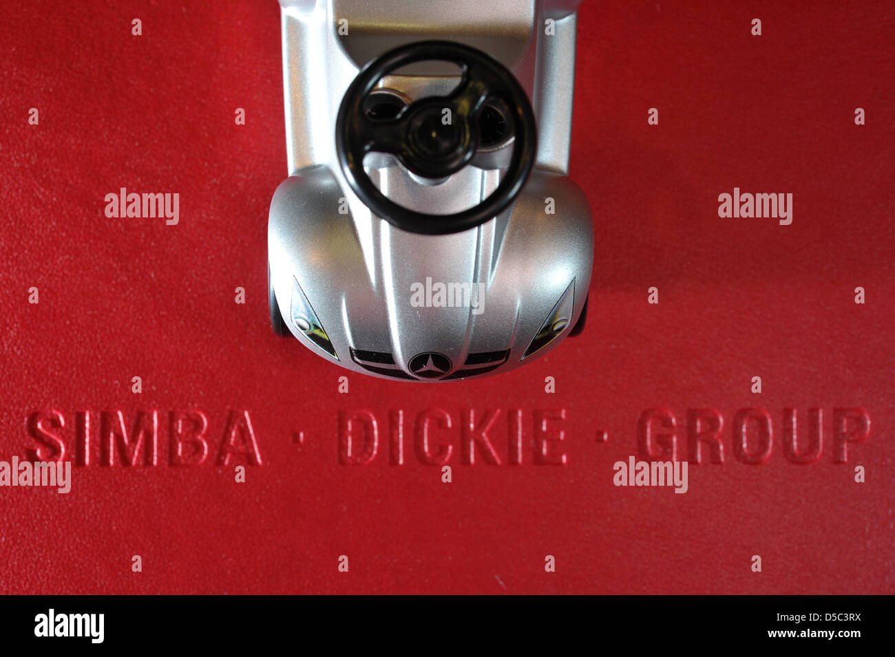 A model of a BIG-Bobby-Car in form of a Mercedes stands on a block with the  company's name in the company's centre in Fuerth, Germany, 28 January 2010.  Toy manufacturer Simba Dicke